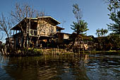 Inle Lake Myanmar. All the buildings are constructed on piles. Residents travel around by canoe, but there are also bamboo walkways and bridges over the canals, monasteries and stupas. 